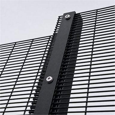 Full-length clamp bar securing a mesh panel to a post