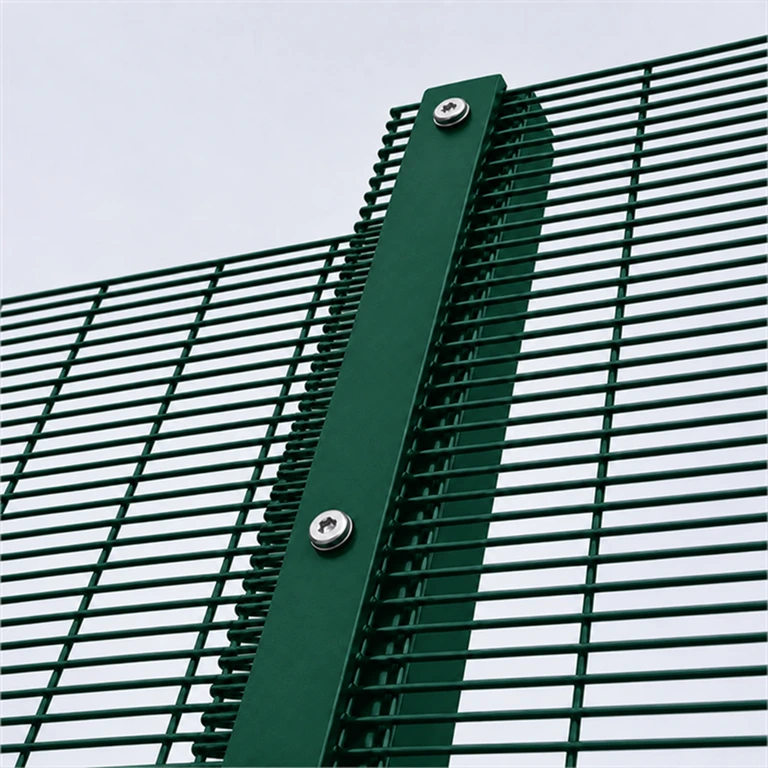 Full-length clamp bar securing a mesh panel to a post